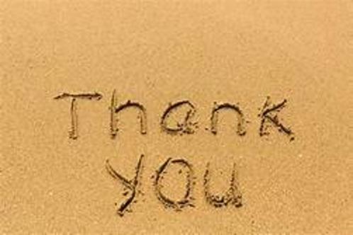 A sand writing that says thank you in the sand.